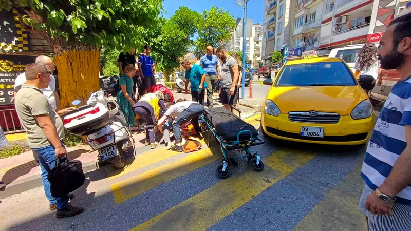 Aydın'ın Efeler ilçesinde ticari taksi, yolun karşısına geçmeye çalışan kadın